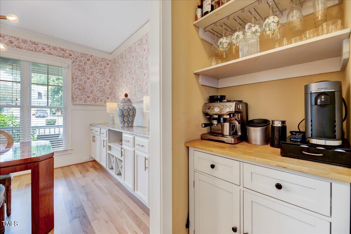 2901 Brighton Bluff Drive Apex, NC 27539 - Photo 12 of 35 a hallway with white cabinets and wooden floor