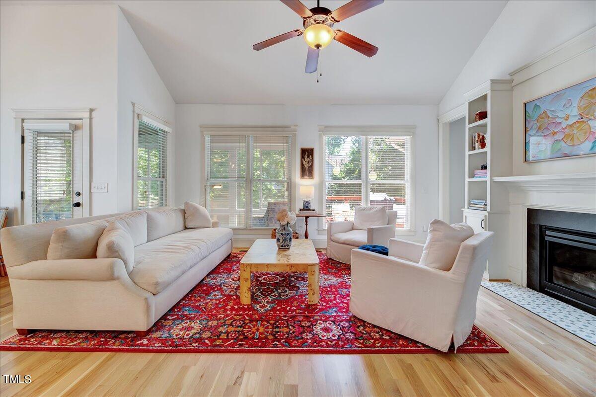 2901 Brighton Bluff Drive Apex, NC 27539 - Photo 13 of 35 a living room with furniture fireplace and a large window