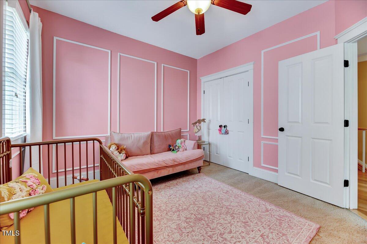 2901 Brighton Bluff Drive Apex, NC 27539 - Photo 21 of 35 a bedroom with furniture and a window