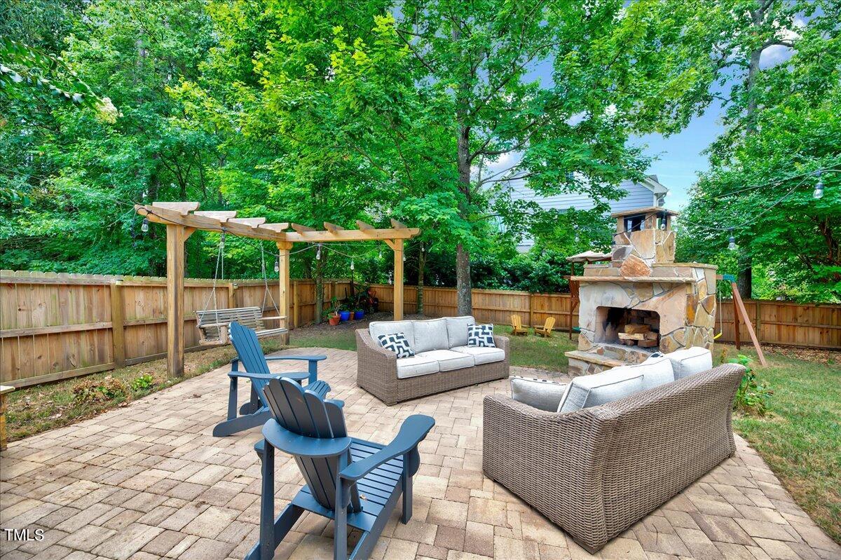 2901 Brighton Bluff Drive Apex, NC 27539 - Photo 28 of 35 a view of a patio with couches chairs and a fire pit