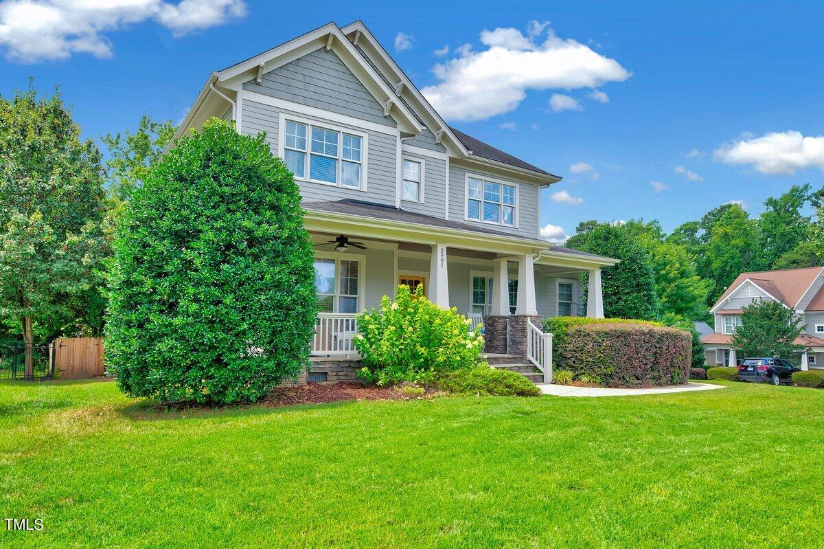2901 Brighton Bluff Drive Apex, NC 27539 - Photo 3 of 35 a front view of a house with a yard