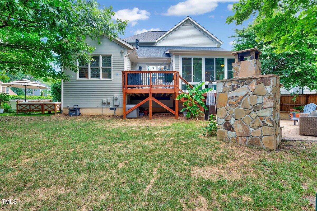 2901 Brighton Bluff Drive Apex, NC 27539 - Photo 32 of 35 a view of a house with a yard and sitting area