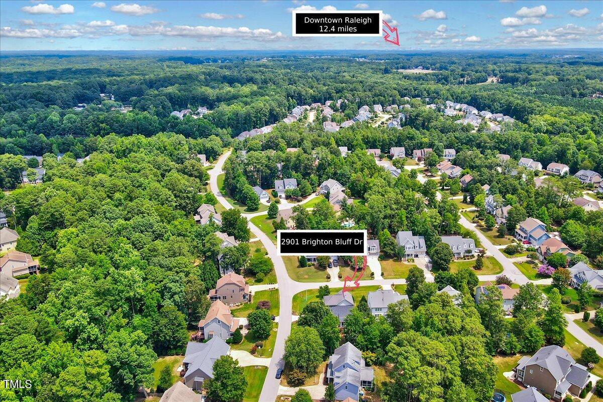 2901 Brighton Bluff Drive Apex, NC 27539 - Photo 35 of 35 a view of a house with a yard and garden