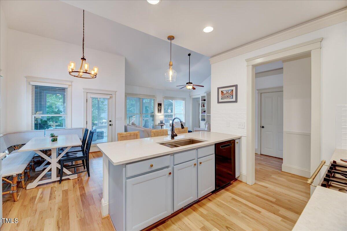2901 Brighton Bluff Drive Apex, NC 27539 - Photo 7 of 35 a room with kitchen island a sink and a stove top oven
