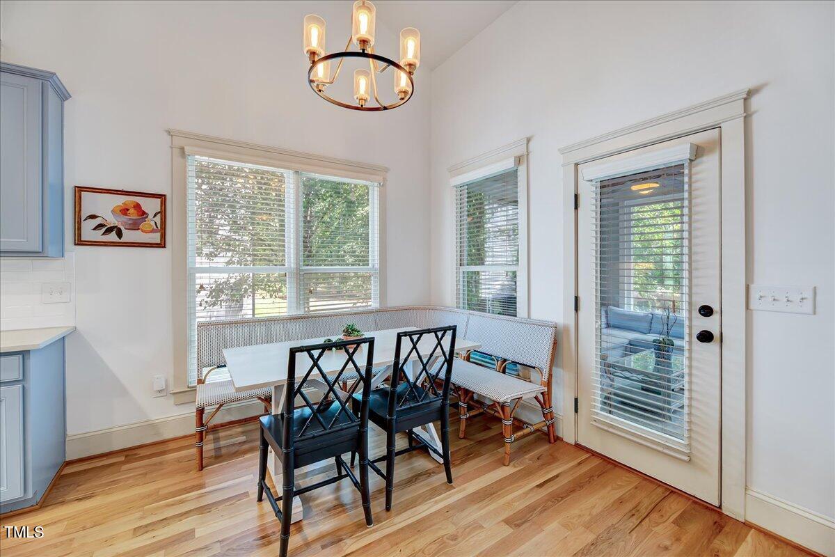 2901 Brighton Bluff Drive Apex, NC 27539 - Photo 9 of 35 a view of a dining room with furniture window and wooden floor