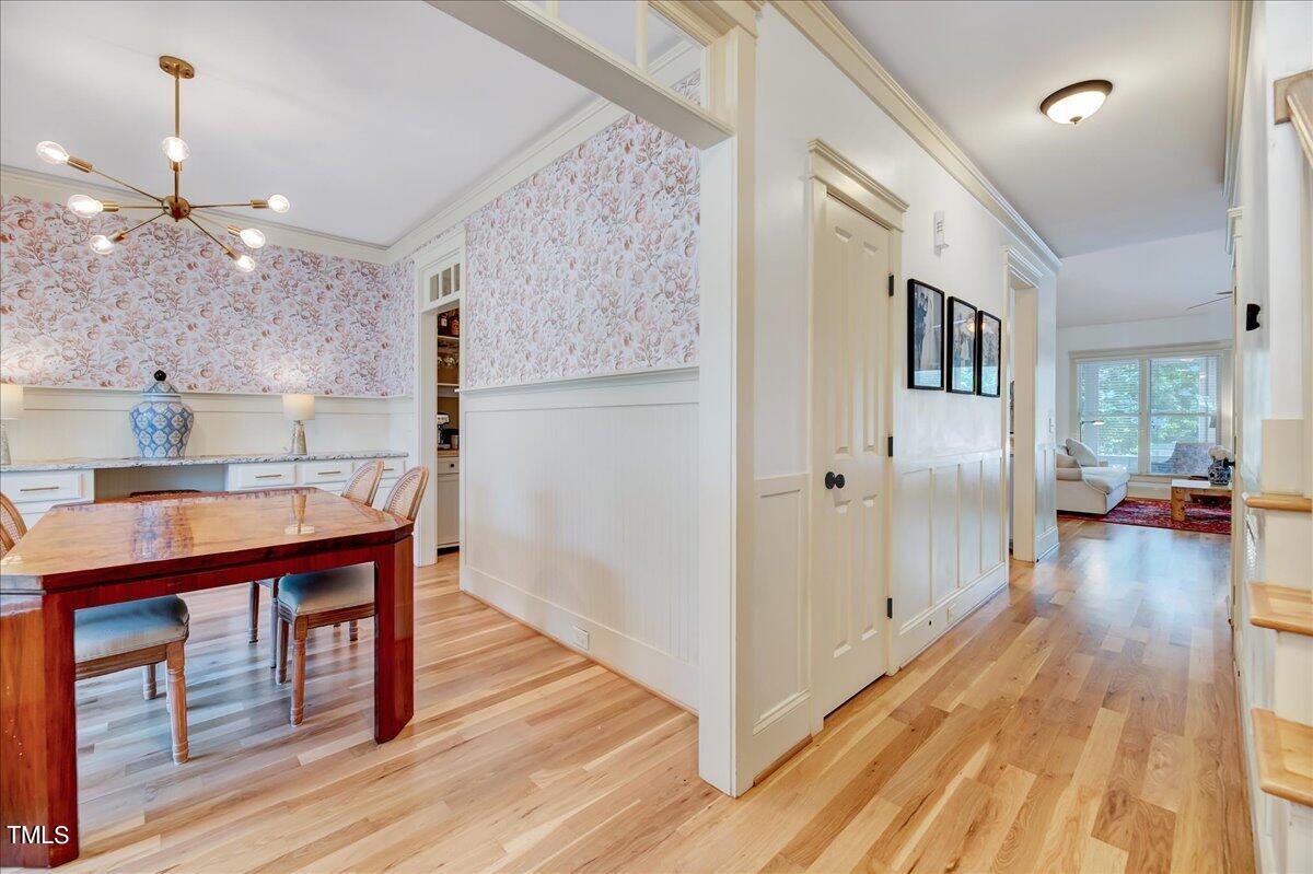 2901 Brighton Bluff Drive Apex, NC 27539 - Photo 10 of 35 a kitchen with stainless steel appliances granite countertop a refrigerator a sink dishwasher a stove and a dining table with wooden floor