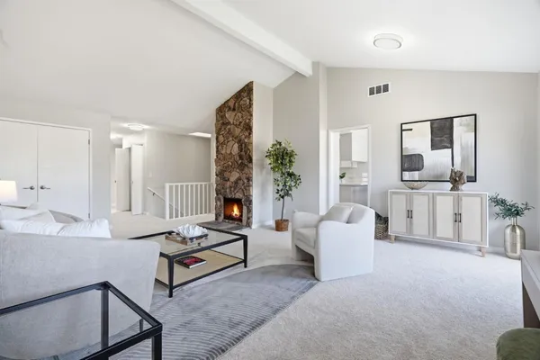 a living room with furniture and a table