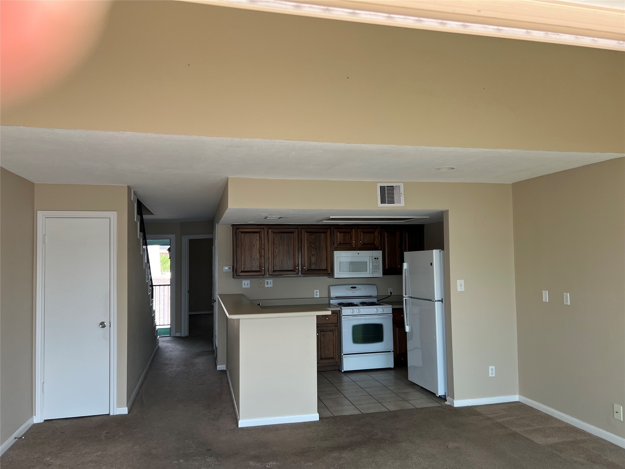 7041 Kingston Cove Lane Willis, TX 77318 - Photo 5 of 19 a kitchen with stainless steel appliances a refrigerator and a stove top oven