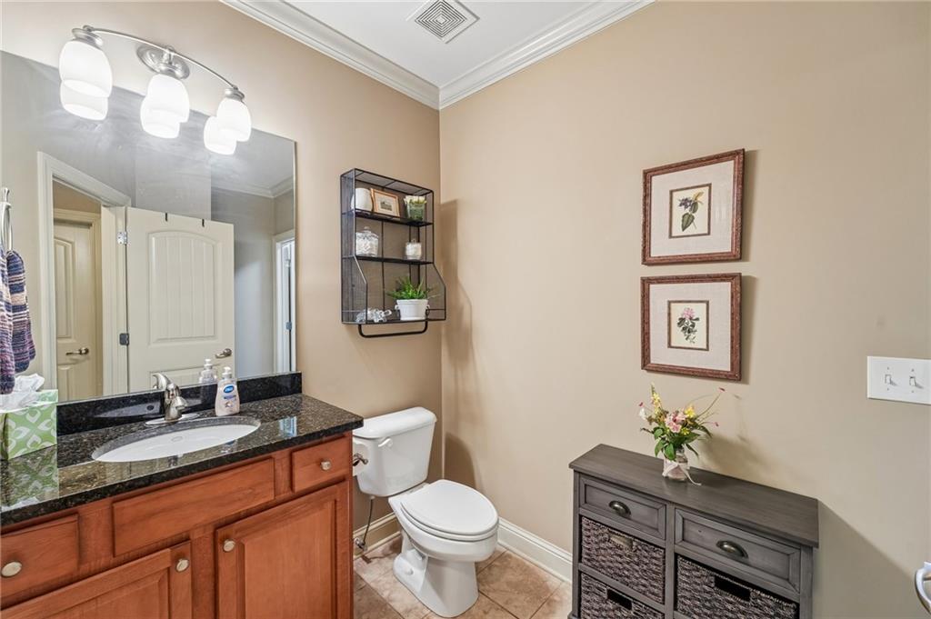 189 Red Trillium Ridge Big Canoe, GA 30143 - Photo 65 of 98 a bathroom with a toilet a sink and mirror
