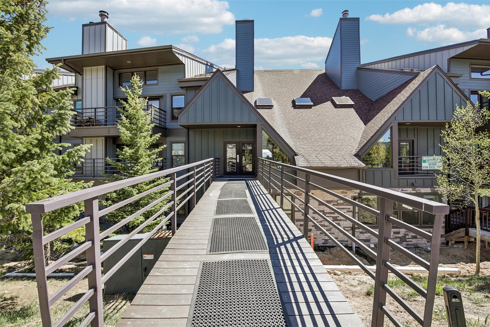 89310 Ryan Gulch Road, Unit 103 Silverthorne, CO 80498 - Photo 18 of 48 a balcony view with wooden floor and fence