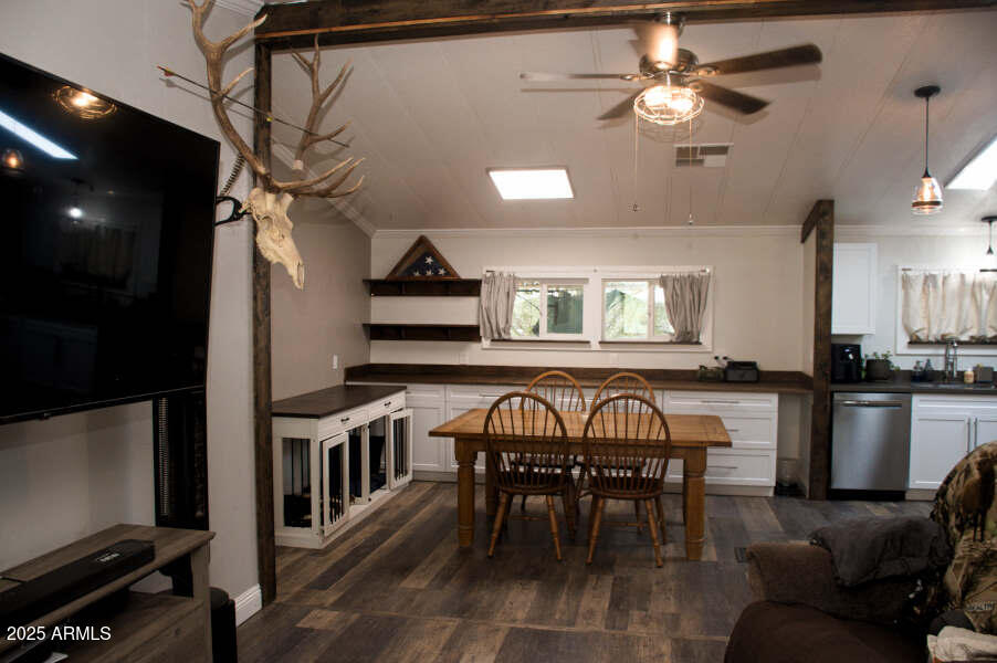200 North Tomahawk Road Apache Junction, AZ 85119 - Photo 13 of 56 a view of a dining room with furniture window and wooden floor