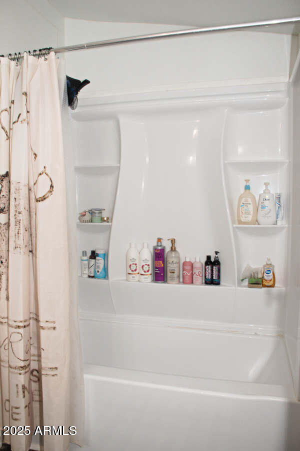 200 North Tomahawk Road Apache Junction, AZ 85119 - Photo 29 of 56 a bathroom with a bathtub and a shower