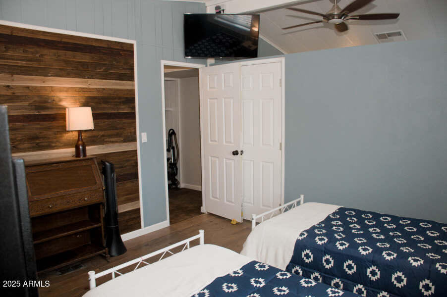 200 North Tomahawk Road Apache Junction, AZ 85119 - Photo 36 of 56 a bedroom with a bed and a television