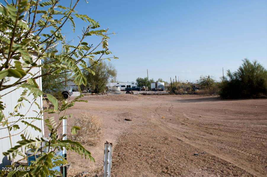 200 North Tomahawk Road Apache Junction, AZ 85119 - Photo 41 of 56 a view of dirt field with large trees
