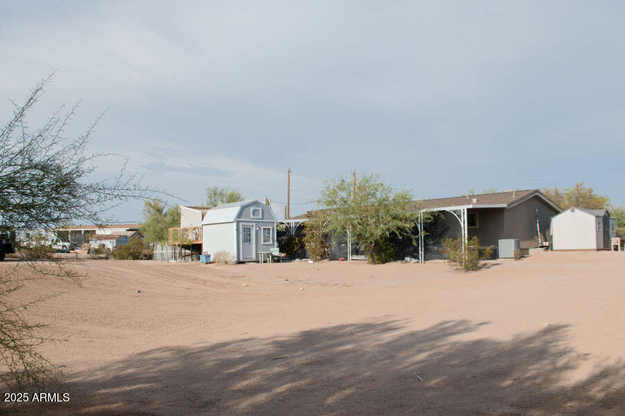 200 North Tomahawk Road Apache Junction, AZ 85119 - Photo 46 of 56 a view of a house with snow on the road