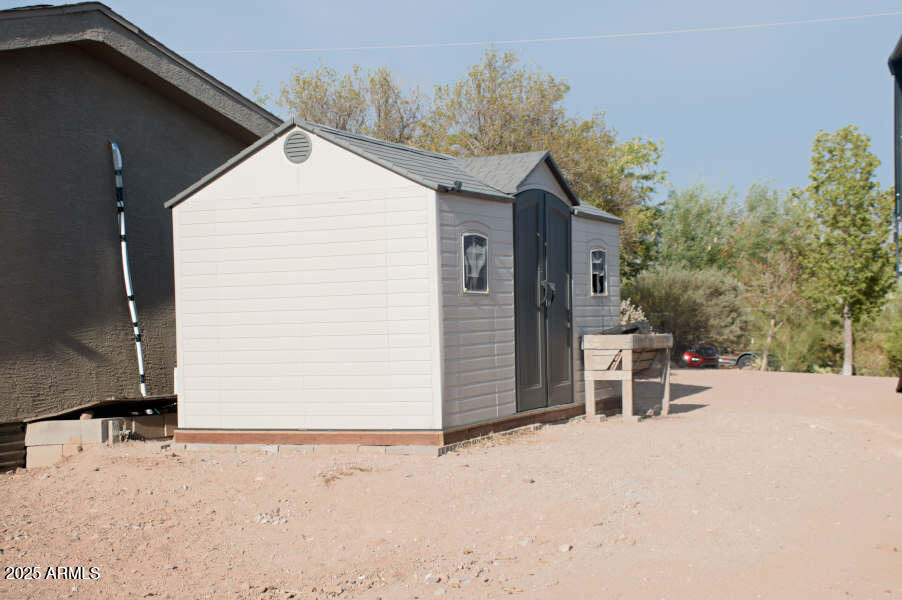 200 North Tomahawk Road Apache Junction, AZ 85119 - Photo 47 of 56 a view of a house with a backyard