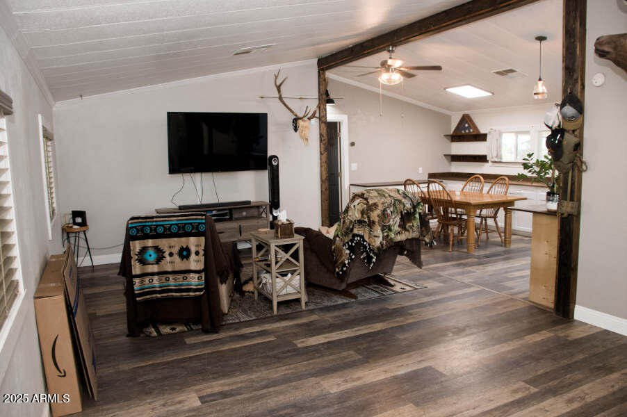 200 North Tomahawk Road Apache Junction, AZ 85119 - Photo 9 of 56 a view of a livingroom with furniture and a flat screen tv