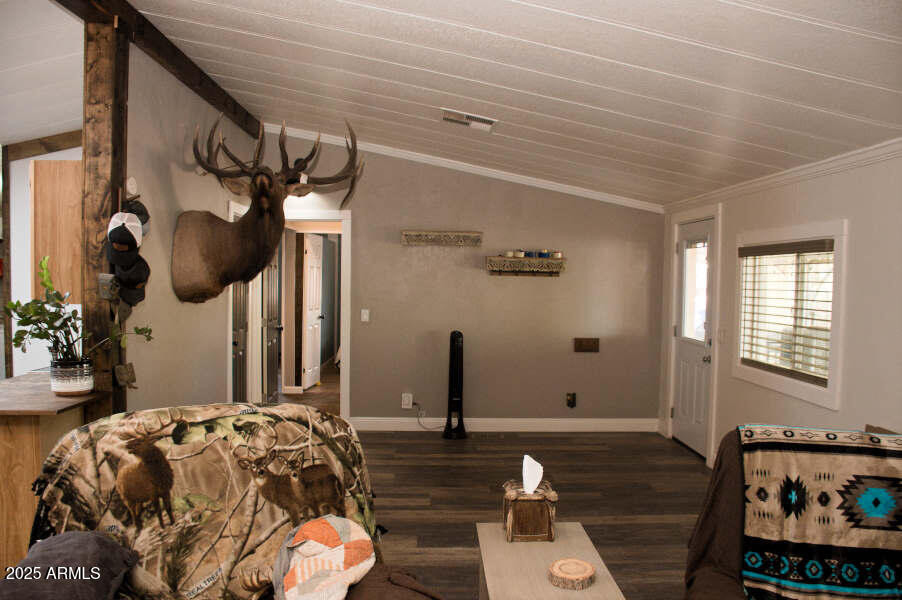 200 North Tomahawk Road Apache Junction, AZ 85119 - Photo 10 of 56 a bedroom with bed and wooden floor