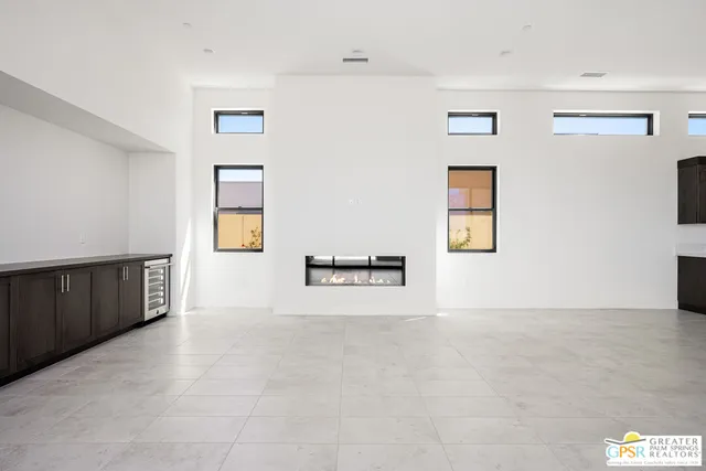 a view of an empty room with windows