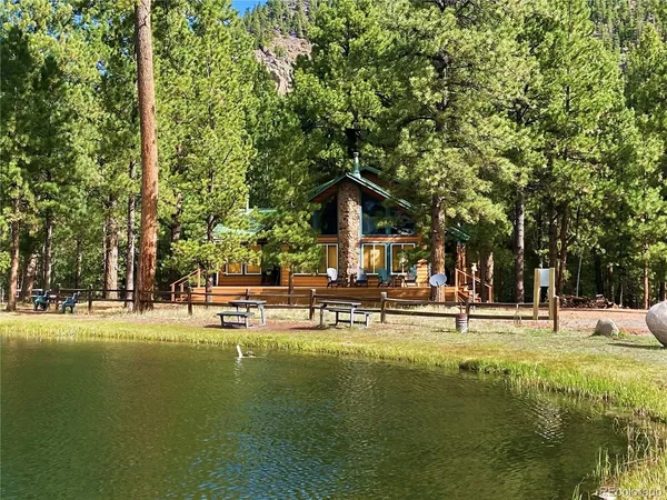 a view of a swimming pool with an outdoor seating