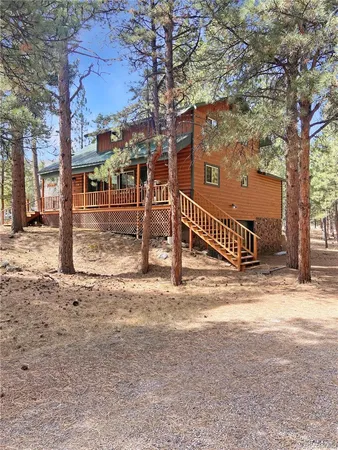 a view of a yard with snow on the road