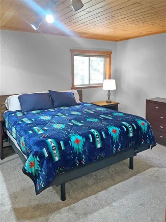 a bedroom with a bed in it and window