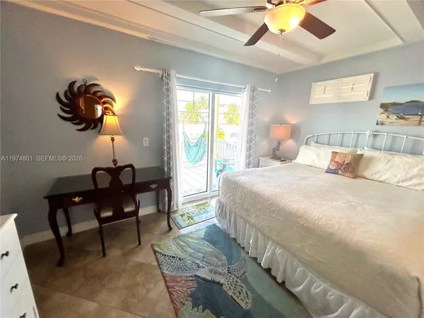 a bed room with a bed and a night stand