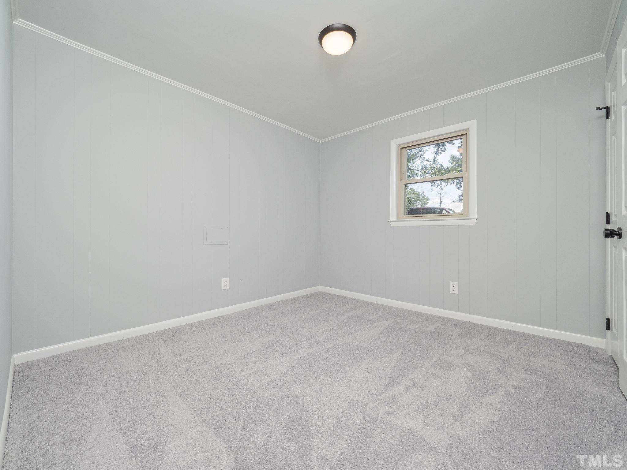 5309 Knollwood Road Raleigh, NC 27609 - Photo 13 of 19 an empty room with a window
