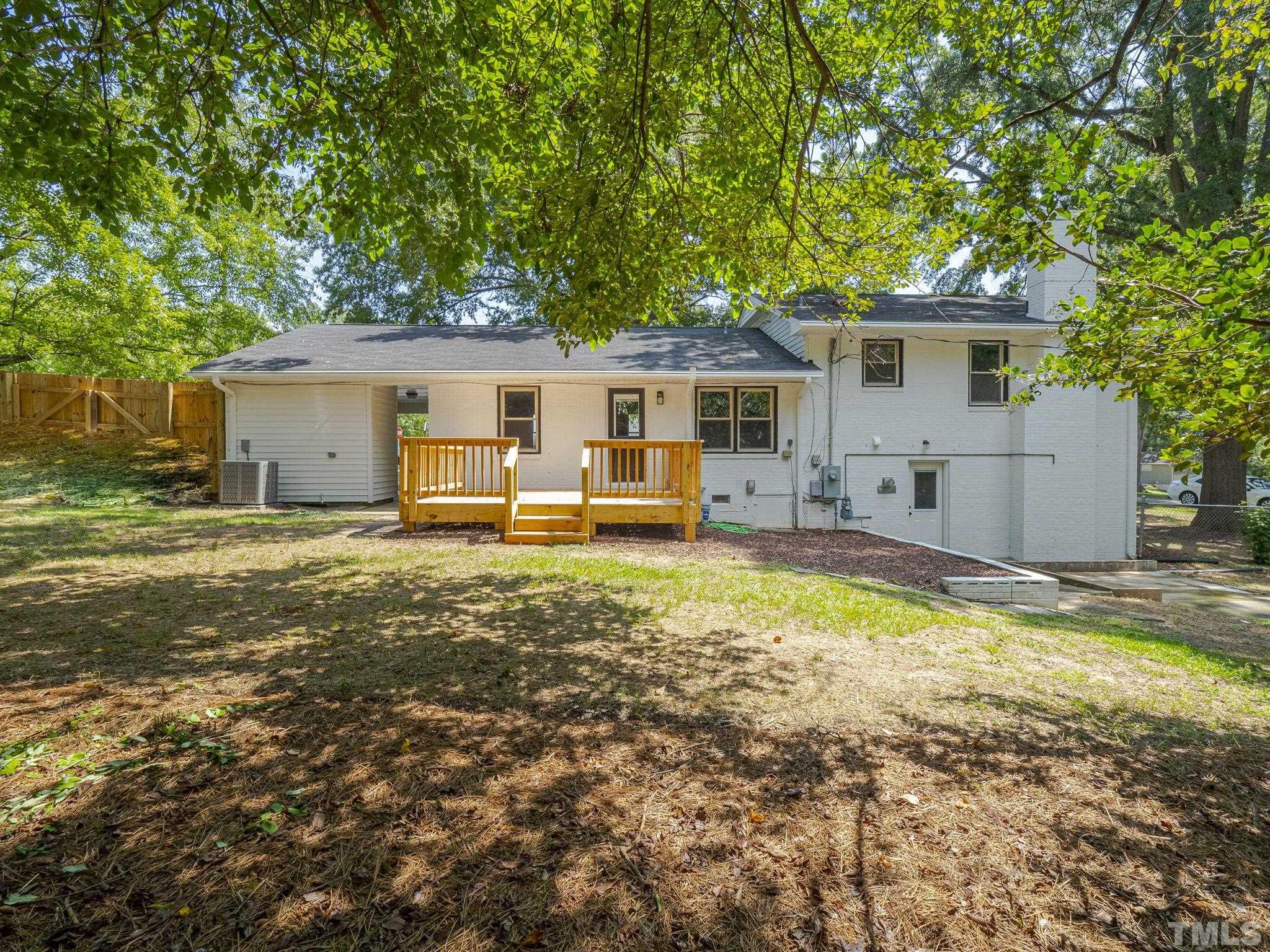 5309 Knollwood Road Raleigh, NC 27609 - Photo 18 of 19 a view of a house with a yard