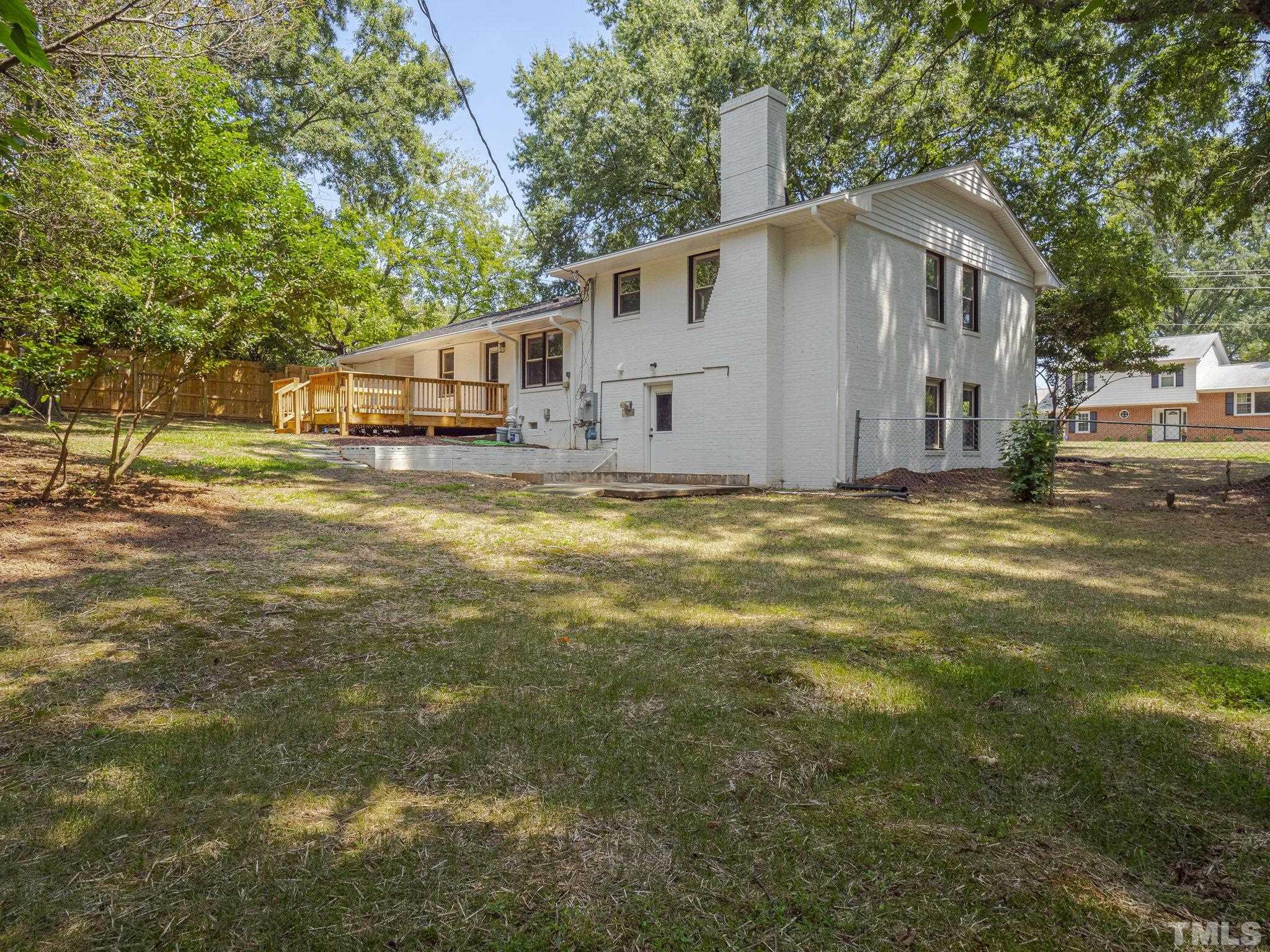 5309 Knollwood Road Raleigh, NC 27609 - Photo 19 of 19 a front view of house with yard and trees in the background