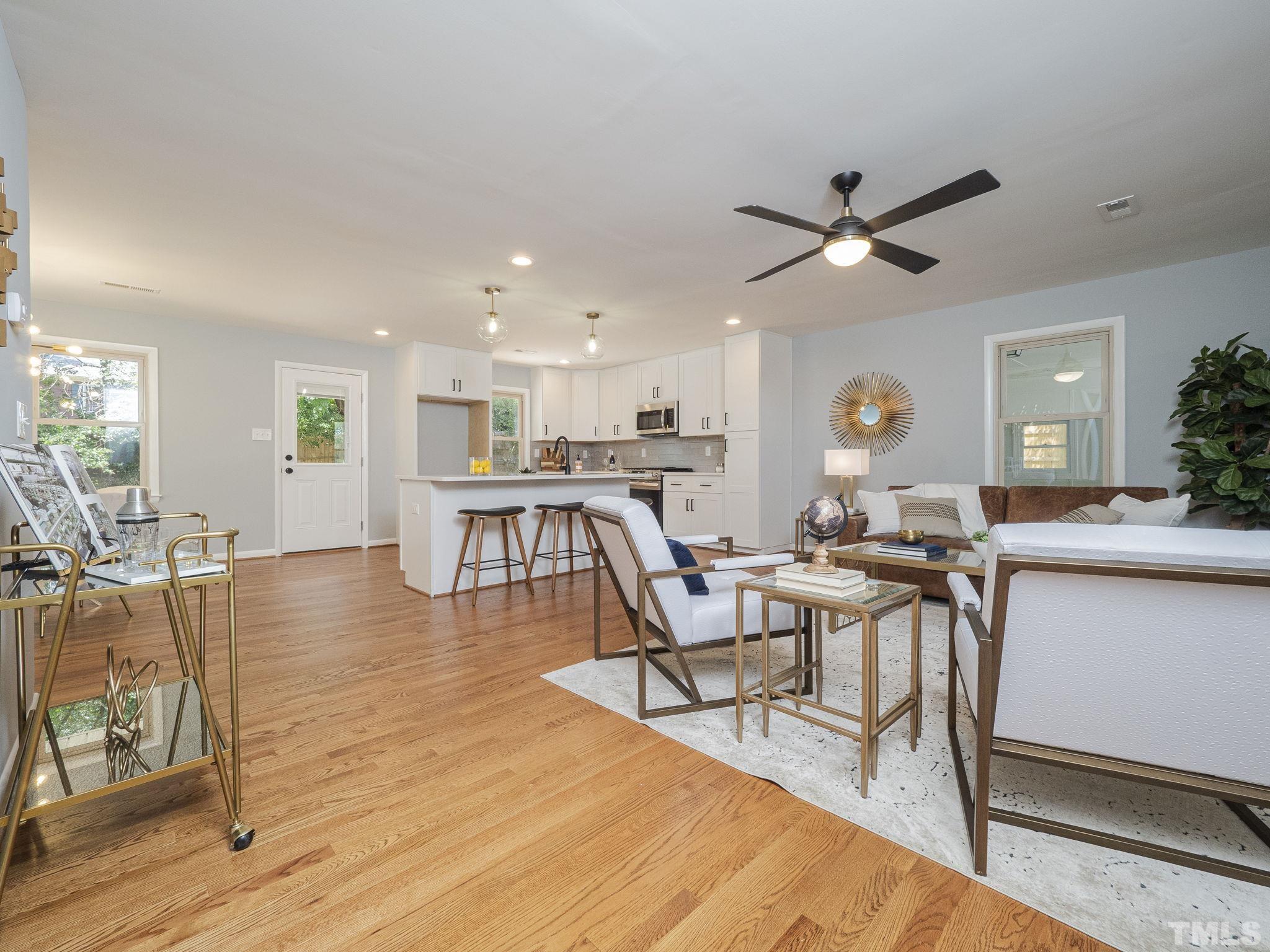 5309 Knollwood Road Raleigh, NC 27609 - Photo 3 of 19 a living room with furniture and a wooden floor