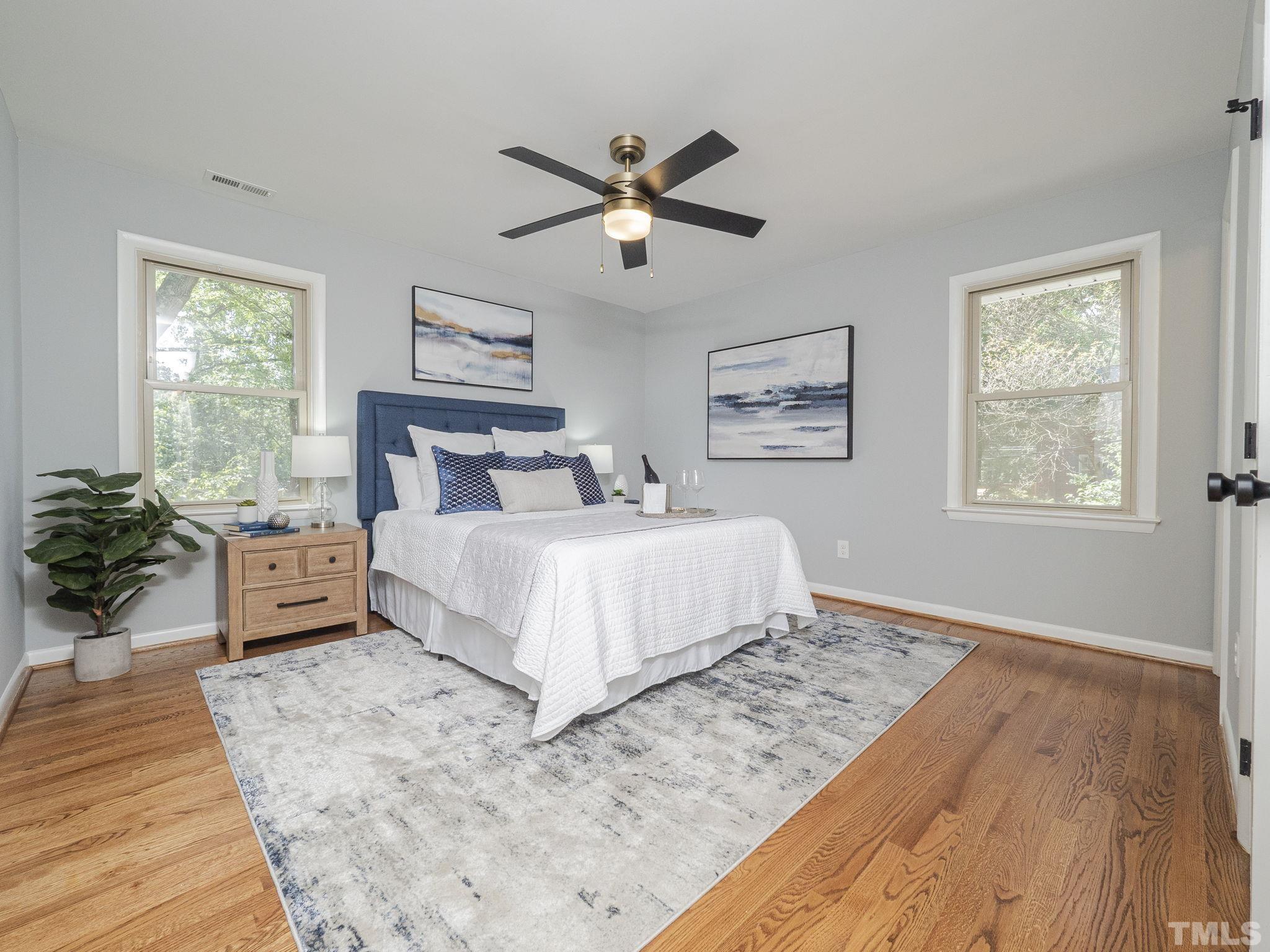 5309 Knollwood Road Raleigh, NC 27609 - Photo 9 of 19 a bedroom with a large bed and a window