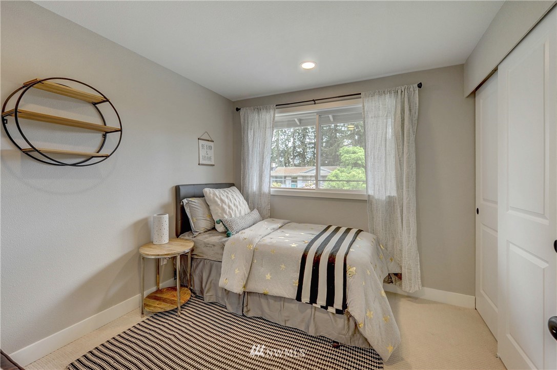 31 218th Place Southwest Bothell, WA 98021 - Photo 14 of 26 a bedroom with a bed and a window