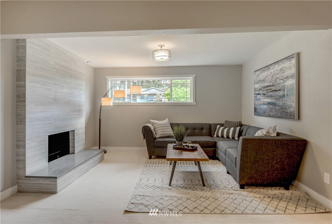 31 218th Place Southwest Bothell, WA 98021 - Photo 20 of 26 a living room with furniture a rug and a fireplace