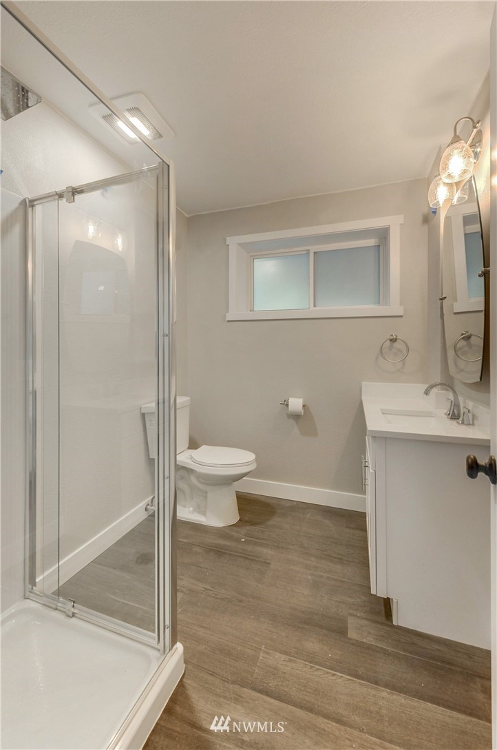 31 218th Place Southwest Bothell, WA 98021 - Photo 22 of 26 a bathroom with a toilet a sink and shower