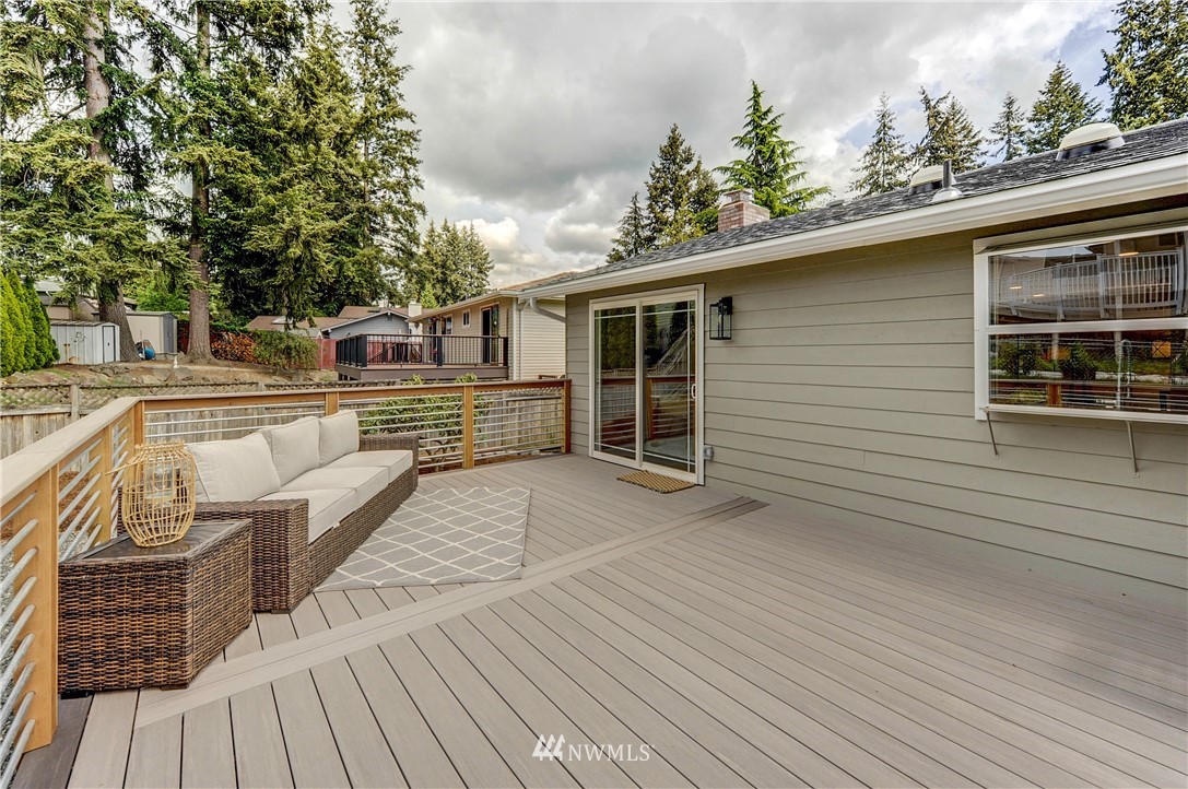 31 218th Place Southwest Bothell, WA 98021 - Photo 24 of 26 a view of a deck with couches floor to ceiling window with wooden floor