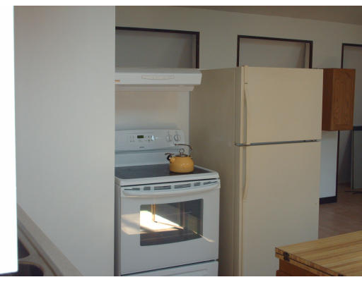 86 B Oxbow Road Charlton, MA 01507 - Photo 23 of 28 a white refrigerator freezer and a stove sitting inside of a kitchen