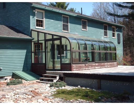 86 B Oxbow Road Charlton, MA 01507 - Photo 5 of 28 a front view of a house with a yard
