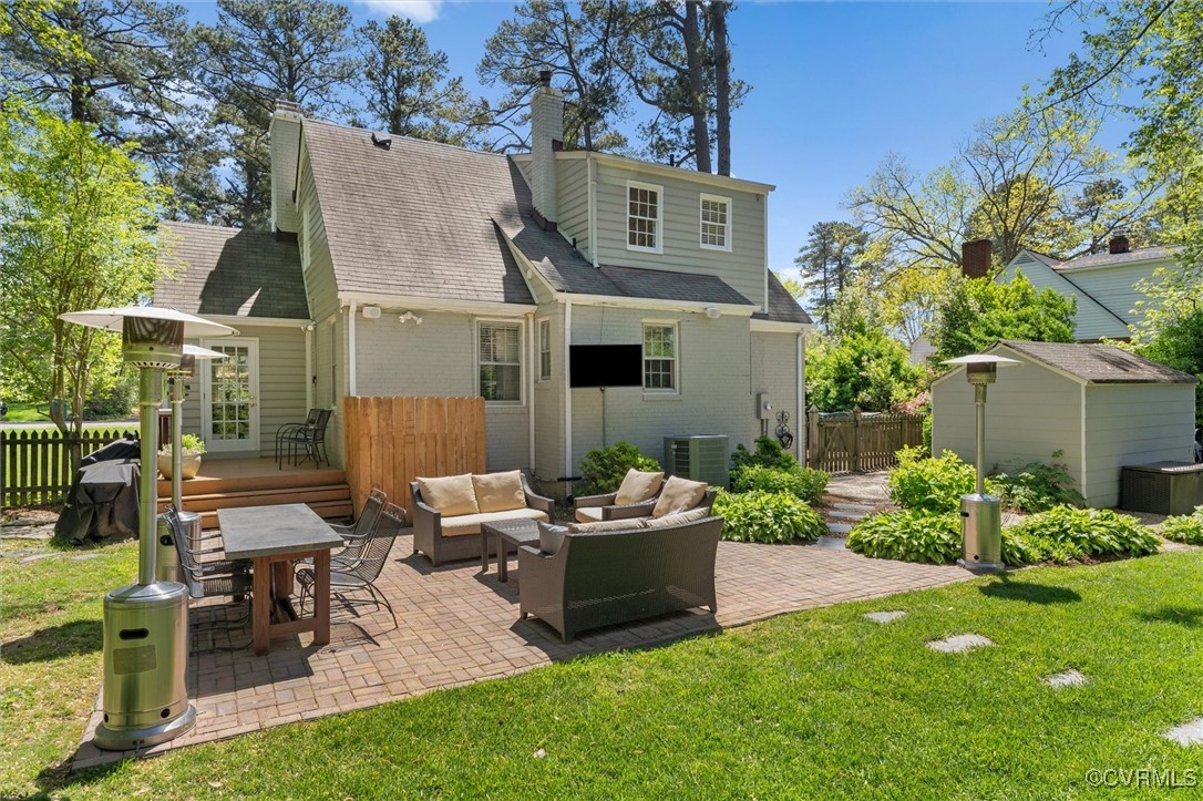1210 Skipwith Road Henrico, VA 23229 - Photo 12 of 32 a view of a house with backyard sitting area and garden