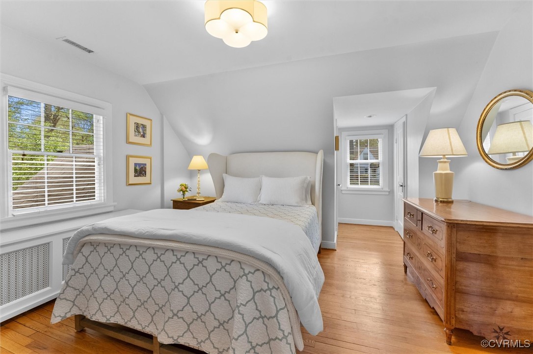 1210 Skipwith Road Henrico, VA 23229 - Photo 30 of 32 a bedroom with a bed mirror and a window