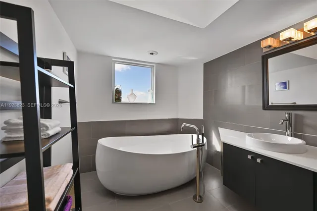 a bathroom with a toilet a sink and shower