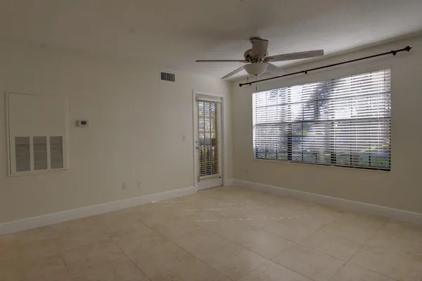 a view of an empty room with a window