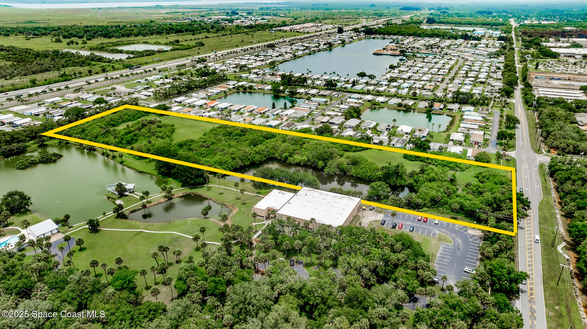 0 South John Rodes Boulevard Melbourne, FL 32934 - Photo 12 of 14 an aerial view of residential houses with outdoor space and river