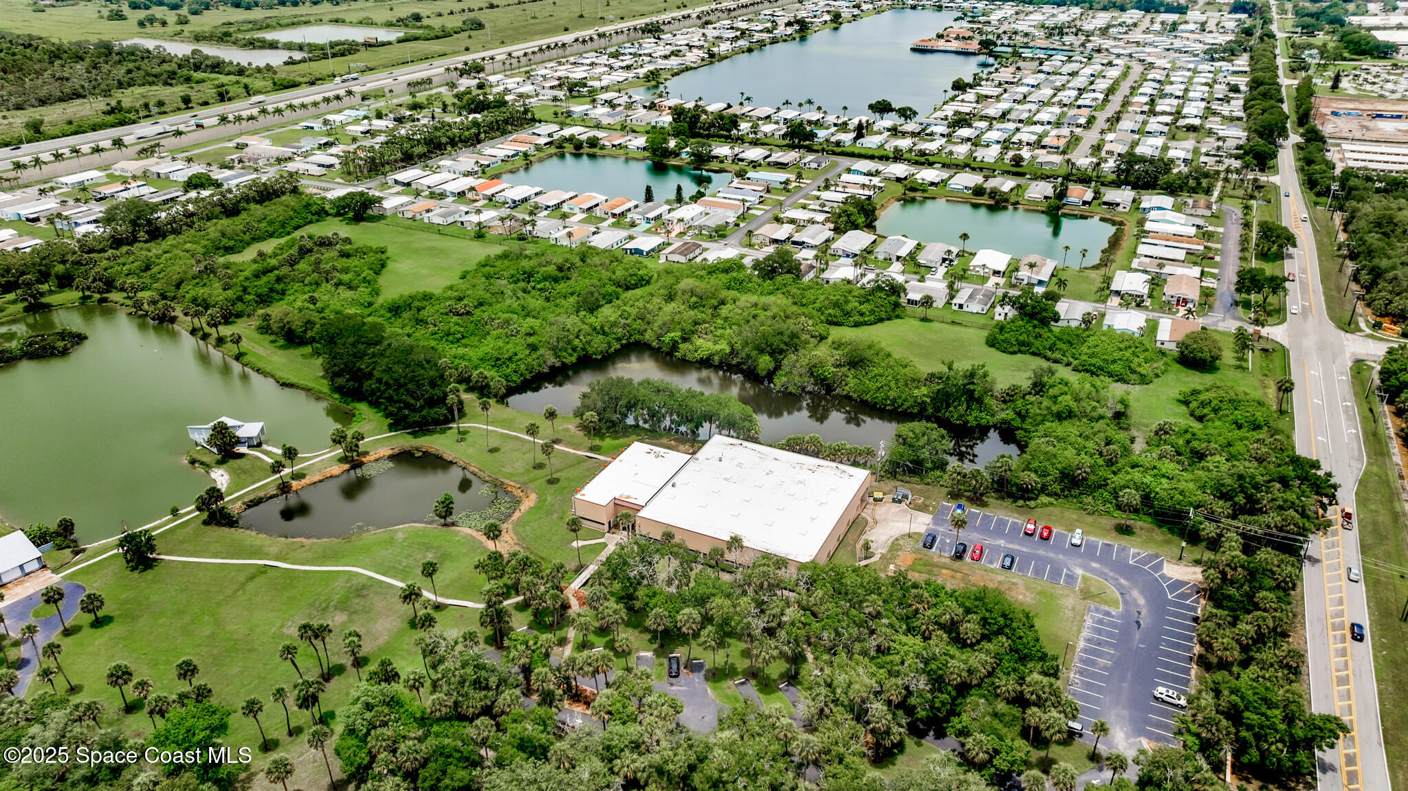0 South John Rodes Boulevard Melbourne, FL 32934 - Photo 5 of 14 an aerial view of residential house with outdoor space and swimming pool