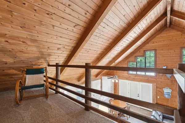 a bed sitting in a room next to a window