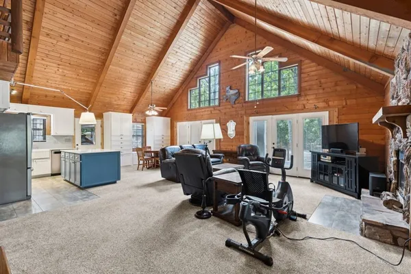 a room with gym equipment and a large window