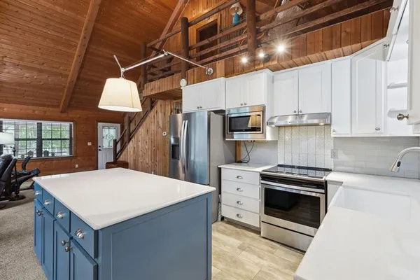 a kitchen that has a cabinets and a stove