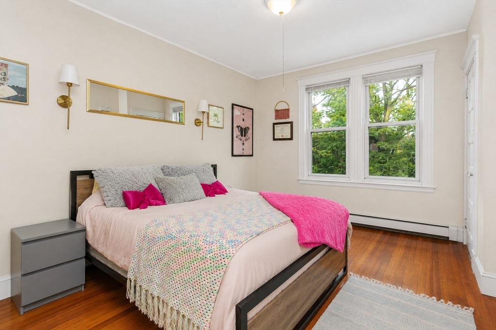 8 Colliston Road Boston, MA 02135 - Photo 9 of 40 a bedroom with a bed and a window