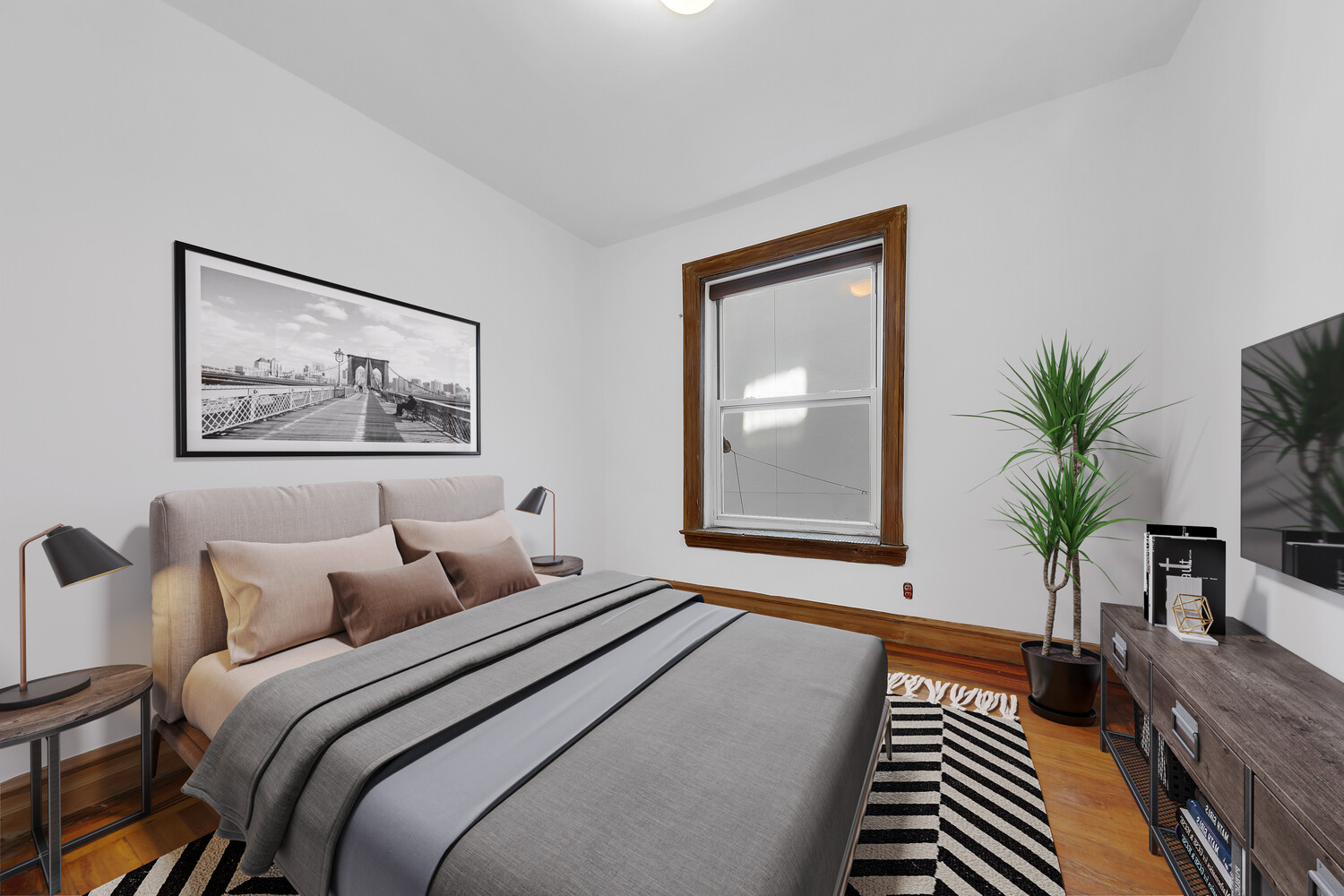 261 West 22nd Street, Unit 11 Manhattan, NY 10011 - Photo 5 of 10 a bedroom with furniture and a large window