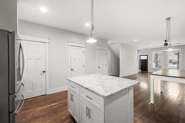 a kitchen with a sink and refrigerator